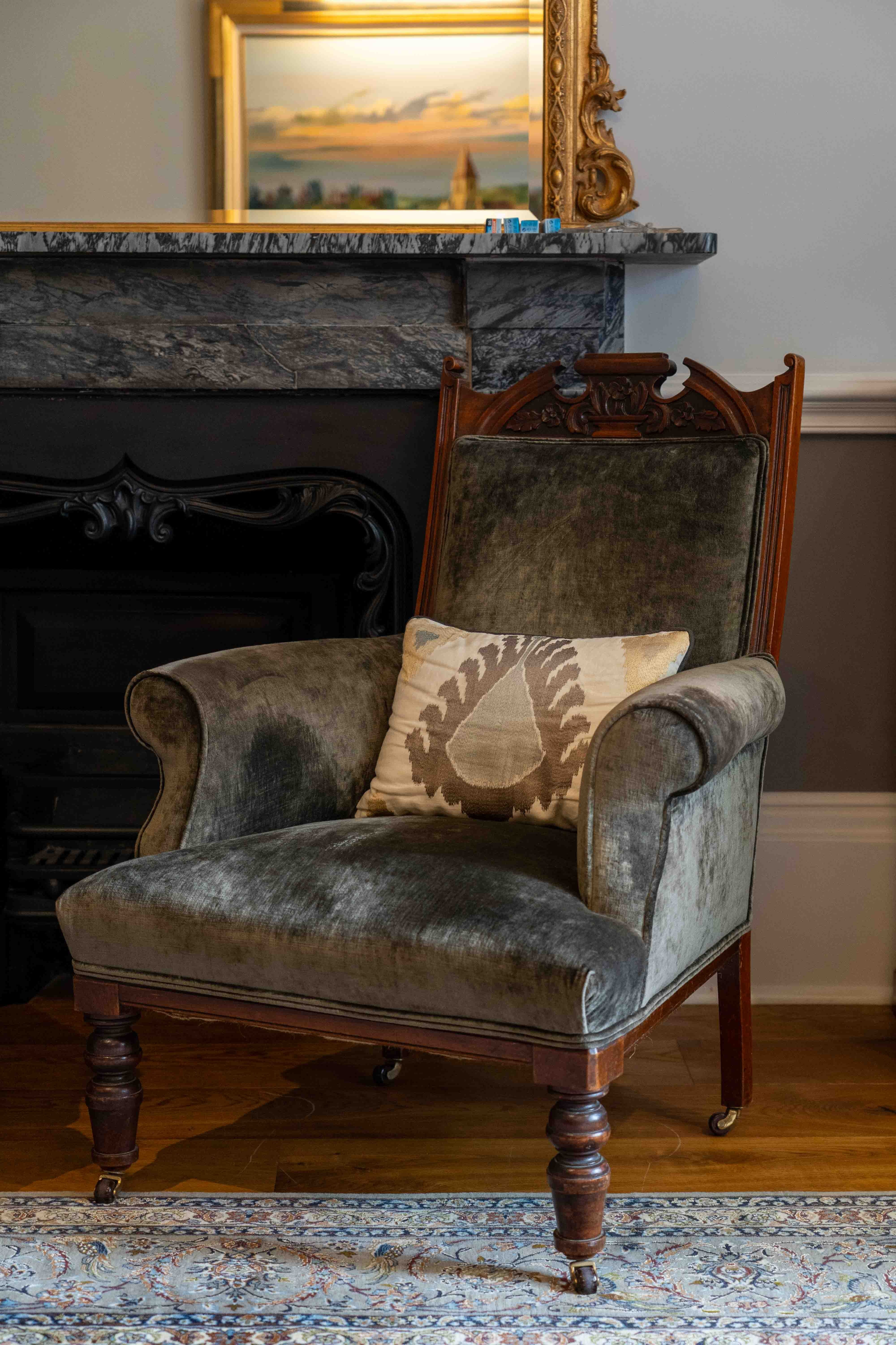 A pair of late Victorian upholstered walnut armchairs, width 73cm, depth 68cm, height 98cm. Condition - fair